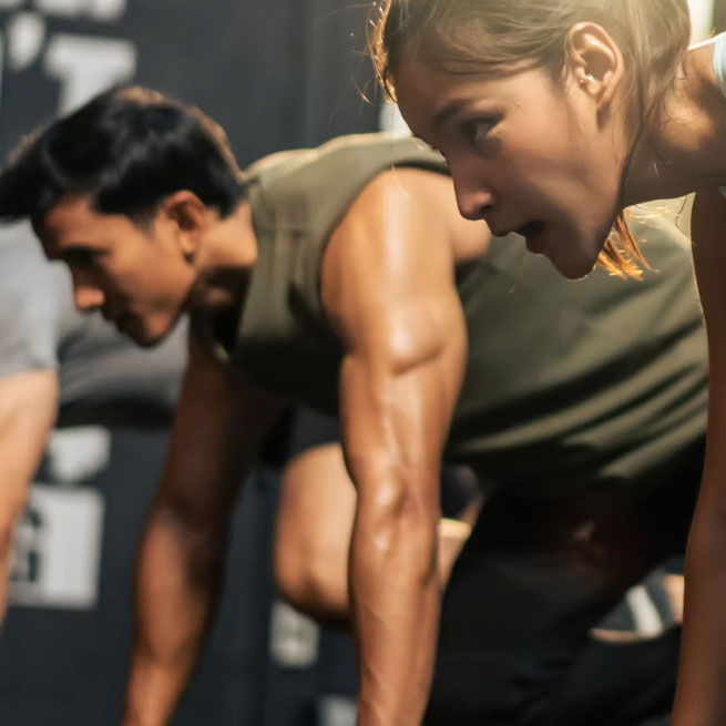 young female and male doing a Hybrid HIIT class