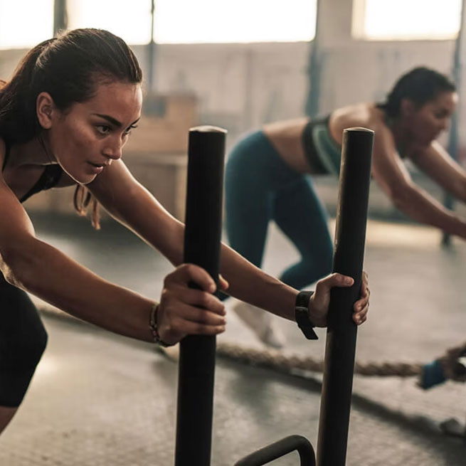 2 women doing hybrid track fitness session