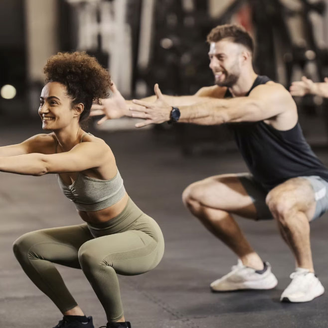 a woman and a man do legs bum and core fitness lesson